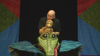 Doug onstage with Monkey and Crocodile puppets